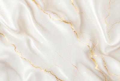 The primary subject of the image is a white marble wall with gold veins. The setting is a room with a white marble wall as the main focus. The visual style is a close-up of the marble wall, showcasing its intricate patterns and textures. The colors and mood of the image are predominantly white and gold, giving it a luxurious and elegant appearance.