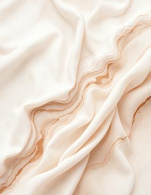 The primary subject of the image is a white sheet with a pattern of gold and brown streaks. The sheet is draped over a surface, creating a visually appealing and textured appearance. The setting appears to be a bedroom or a similar environment where the sheet is used for bedding or decoration. The visual style of the image is a combination of photo and digital art, as it captures the intricate pattern of the sheet while maintaining a realistic and natural appearance. The colors and mood of the image are