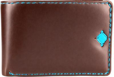 The primary subject of the image is a brown leather wallet with a blue stitched design. The wallet is open, revealing a blank interior. The setting is a close-up of the wallet, showcasing its details. The visual style is a realistic representation of the wallet, and the colors and mood are warm and inviting.