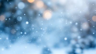 Primary subject: Snowflakes
Setting/background: Snowy sky
Visual style: Photo
Colors and mood: Blue and white, cold and serene