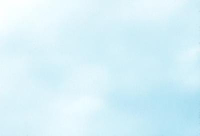 The primary subject of the image is a cloudy blue sky. The setting is a vast, open space with no visible landmarks or objects. The visual style is a natural, outdoor scene. The colors and mood are predominantly blue and calm, with a hint of tranquility.