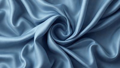 The primary subject of the image is a blue fabric, which is the main object, scene, or focus of the image. The setting or background is a blue cloth, and the visual style is a photo. The dominant colors and overall atmosphere are blue and serene.