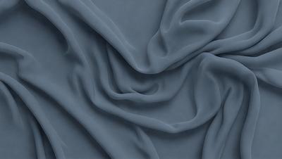 The primary subject of the image is a blue fabric, which is the main object, scene, or focus of the image. The setting or background is a blue cloth, and the visual style is a photo. The dominant colors and overall atmosphere are blue and calm.