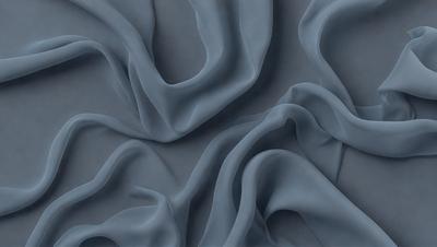 The primary subject of the image is a close-up of a blue fabric, possibly a piece of clothing or a curtain. The setting is a gray background, which contrasts with the blue fabric. The visual style appears to be a digital art or illustration, as the fabric is depicted in a detailed and artistic manner. The colors and mood of the image are predominantly blue, creating a calm and serene atmosphere.