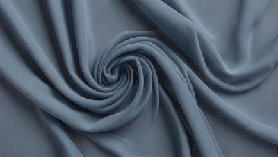 The primary subject of the image is a blue fabric, which is the main object, scene, or focus of the image. The setting or background is a blue cloth, and the visual style is a photo. The dominant colors and overall atmosphere are blue and dark, creating a moody and dramatic effect.