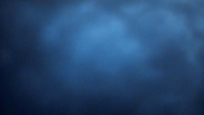 The primary subject of the image is a blue sky with clouds. The setting is a cloudy day, and the visual style is a photo. The dominant colors are blue and white, creating a calm and serene atmosphere.