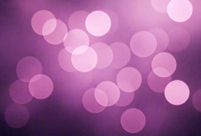 The primary subject of the image is a purple background with a pattern of pink and white circles. The setting is a dark background, which contrasts with the bright colors of the circles. The visual style is a digital art or illustration, as the circles are arranged in a visually appealing manner. The colors and mood of the image are predominantly purple and pink, creating a warm and inviting atmosphere.
