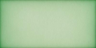 The primary subject of the image is a large, green sheet of paper. The setting is a plain, white background, and the visual style is a close-up of the paper. The colors and mood of the image are predominantly green, giving it a calm and serene atmosphere.