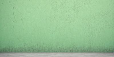 The primary subject of the image is a green wall with a mossy texture. The setting is a room with a concrete floor. The visual style is a photo, and the dominant colors are green and brown. The overall atmosphere is moist and somewhat damp.