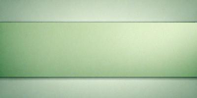 The primary subject of the image is a green background. The setting is a wall, and the visual style is a photo. The colors and mood are predominantly green, creating a calm and soothing atmosphere.
