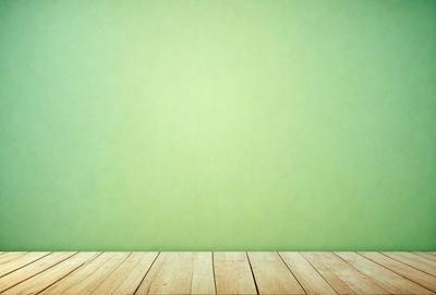 The primary subject of the image is a green wall with a wooden floor. The setting is a room with a green wall, and the visual style is a photo. The dominant colors are green and brown, creating a calm and natural atmosphere.