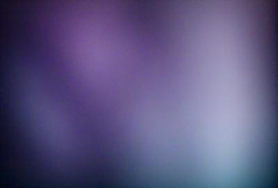 The primary subject of the image is a purple background with a blue hue. The setting is a wall, and the visual style appears to be a digital art or illustration. The dominant colors are purple and blue, creating a calm and serene atmosphere.