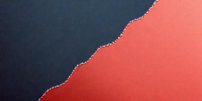 The primary subject of the image is a red surface with a white line or pattern on it. The setting appears to be a room with a red wall, and the visual style is a combination of a photo and a drawing. The dominant colors are red and white, creating a bold and striking appearance.