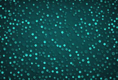 The primary subject of the image is a blue background with a pattern of white dots. The setting appears to be a dark room, and the visual style is a close-up of the blue background with the white dots. The colors and mood of the image are predominantly blue and dark, creating a moody and atmospheric scene.