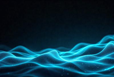 The primary subject of the image is a blue wave, which is the main focus of the scene. The setting is a dark background, which contrasts with the blue wave. The visual style is a digital art or illustration, as the wave appears to be a digital creation. The dominant colors are blue and black, creating a calm and serene atmosphere.