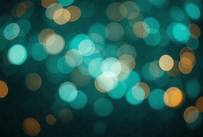 The primary subject of the image is a brightly lit, colorful background featuring a blue hue. The setting appears to be a nighttime scene with a dark background. The visual style of the image is a combination of a photo and digital art, creating a unique and vibrant atmosphere. The dominant colors in the image are blue and yellow, with the blue hue being the most prominent. The overall mood of the image is lively and energetic, with the bright lights and colors creating a sense of excitement and movement.