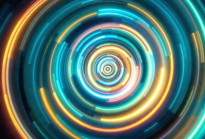 The primary subject of the image is a brightly colored, swirling spiral pattern. The setting is a blue background, which adds to the overall visual style. The spiral pattern is a digital art piece, creating a vibrant and dynamic atmosphere. The dominant colors are blue and yellow, which contribute to the spiral's lively and energetic appearance.