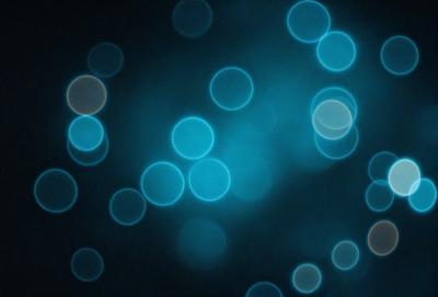 The primary subject of the image is a blue background with a pattern of blue circles. The setting appears to be a dark room, and the visual style is a digital art or illustration. The dominant colors are blue, and the overall atmosphere is calm and serene.