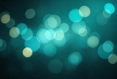The primary subject of the image is a blue background with a pattern of bright lights, creating a visually appealing and colorful scene. The setting appears to be a dark room, with the lights creating a contrast against the darkness. The visual style of the image is a combination of photo and digital art, as it captures the essence of a light pattern on a blue background. The colors and mood of the image are predominantly blue and vibrant, with the lights adding a sense of energy and liveliness to the