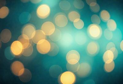 The primary subject of the image is a brightly lit, colorful background featuring a pattern of yellow and green lights. The setting appears to be a dark room, with the lights creating a vibrant and lively atmosphere. The visual style of the image is a combination of a photo and digital art, as the lights are depicted in a way that resembles a painting or a digital illustration. The colors and mood of the image are predominantly yellow and green, with a sense of warmth and energy.