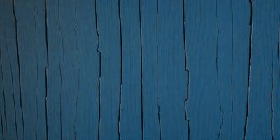 The primary subject of the image is a blue wooden wall with a blue and white striped pattern. The setting is a room with a blue wooden floor. The visual style is a close-up of the wooden wall, showcasing the blue and white striped pattern. The colors and mood of the image are predominantly blue, creating a calm and serene atmosphere.