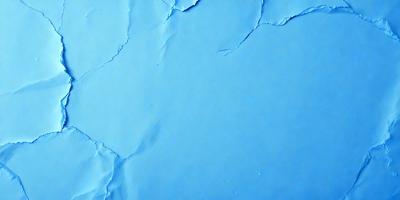 The primary subject of the image is a blue wall with a peeling paint surface. The setting is a room with a blue background. The visual style is a close-up of the peeling paint on the wall. The colors and mood of the image are predominantly blue, with a slightly distressed and aged appearance due to the peeling paint.