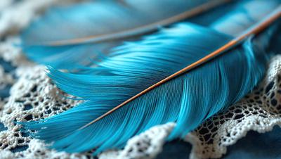 The primary subject of the image is a blue feather, which is the main object, scene, or focus of the image. The setting/background features a white lace or a white cloth, which serves as the surface or backdrop for the feather. The visual style of the image is a close-up of the feather, showcasing its details and texture. The colors and mood of the image are predominantly blue, with the blue feather being the most prominent and eye-catching element in the scene.