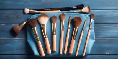 The primary subject of the image is a collection of brushes, which are the main objects in the scene. The brushes are arranged in a blue case, and they are displayed on a table. The setting is indoors, with a table serving as the background. The visual style of the image is a photo, capturing the details of the brushes and the case. The colors in the image are predominantly blue, which gives the scene a calm and organized atmosphere.