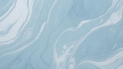 The primary subject of the image is a blue and white marbled wallpaper. The setting is a room with a blue and white marbled wallpapered wall. The visual style is a patterned wallpaper, which gives the room a unique and elegant appearance. The dominant colors are blue and white, creating a calm and soothing atmosphere in the room.