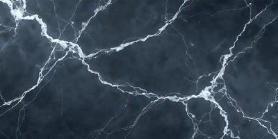 The primary subject of the image is a close-up of a marble wall with a black background. The setting is a dark room, and the visual style is a photo. The colors in the image are predominantly black and white, giving it a moody and dramatic atmosphere.