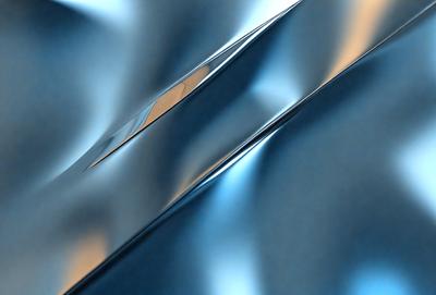 The primary subject of the image is a silver metal surface, which appears to be a metal sheet or a metal wall. The setting is a room with a blue background, which adds a contrasting color to the scene. The visual style of the image is a close-up of the metal surface, showcasing its texture and reflective properties. The colors and mood of the image are predominantly silver and blue, creating a calm and reflective atmosphere.