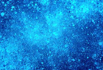 The primary subject of the image is a blue background with a pattern of white specks. The setting appears to be a space or an aquatic environment, as the blue background is reminiscent of the ocean. The visual style of the image is a digital art or illustration, as the white specks on the blue background create a unique and intricate pattern. The colors and mood of the image are predominantly blue and serene, with the white specks adding a touch of contrast and interest to the overall composition.
