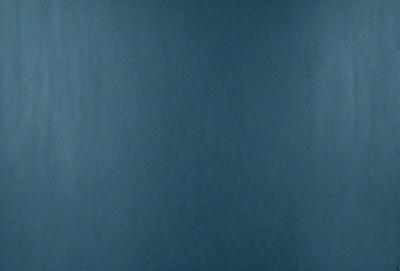 The primary subject of the image is a blue wall. The setting is a room with a blue wall, and the visual style is a photo. The dominant colors are blue, and the overall atmosphere is calm and serene.