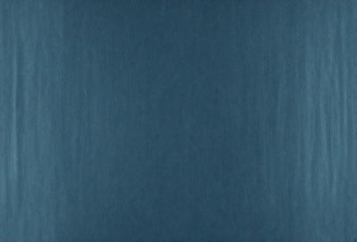 The primary subject of the image is a blue background. The setting is a dark blue sky, and the visual style is a photo. The colors and mood of the image are predominantly dark and moody, with the blue background creating a sense of depth and calmness.