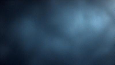 The primary subject of the image is a blue sky with clouds. The setting is a cloudy sky, and the visual style is a photo. The dominant colors are blue and white, creating a calm and serene atmosphere.
