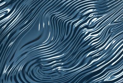 The primary subject of the image is a blue ocean with ripples and waves. The setting is the ocean, and the visual style is a photo. The dominant colors are blue and white, creating a calm and serene atmosphere.