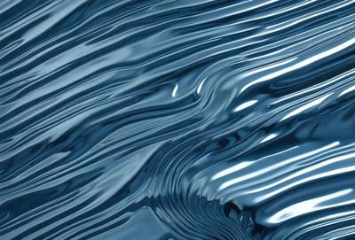 The primary subject of the image is a blue, rippling water surface. The setting is a large body of water, possibly an ocean or a lake. The visual style is a close-up of the water, showcasing its texture and movement. The colors are predominantly blue, creating a serene and calming atmosphere.