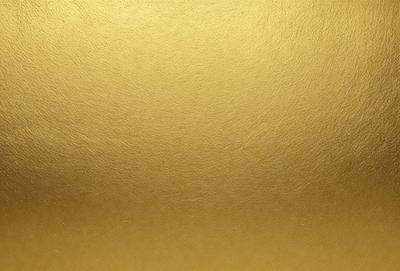 The primary subject of the image is a large, shiny, and golden surface. The setting is a close-up of the surface, which appears to be a wall or a piece of fabric. The visual style is a photo, showcasing the gold material in detail. The colors and mood of the image are predominantly gold, giving it a warm and luxurious atmosphere.