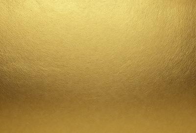 The primary subject of the image is a gold background, which is the main object, scene, or focus of the image. The setting or background is a gold surface, and the visual style is a photo. The colors and mood of the image are dominated by the gold color, which gives the image a warm and luxurious atmosphere.
