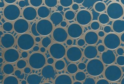 The primary subject of the image is a pattern of circles, which are arranged in a blue background. The circles are of various sizes and are scattered throughout the scene. The setting appears to be a wall or a surface with a blue background, which adds to the overall visual style of the image. The dominant colors in the image are blue and silver, creating a calm and soothing atmosphere.