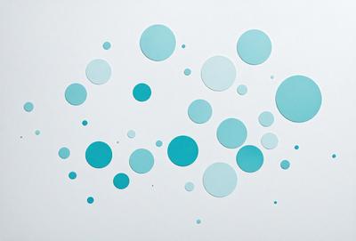 The primary subject of the image is a collection of blue circles, which are scattered across a white background. The circles vary in size and are positioned in different orientations, creating a visually interesting pattern. The overall atmosphere of the image is calm and serene, with the blue circles providing a sense of harmony and balance.