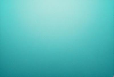 The primary subject of the image is a large, empty, and dark blue sky. The setting is a vast, open space with no visible landmarks or objects. The visual style is a natural, untouched, and unaltered representation of the sky. The colors and mood convey a sense of tranquility and vastness.