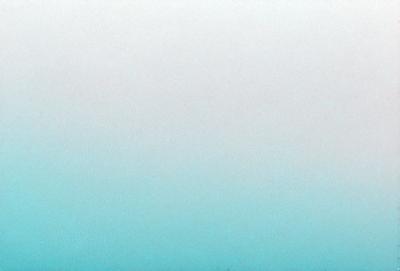 The primary subject of the image is a large body of water, which appears to be a vast ocean. The setting is a clear blue sky, creating a serene and peaceful atmosphere. The visual style of the image is a photo, capturing the beauty of the ocean and the sky. The colors and mood of the image are predominantly blue, which adds to the calming and tranquil ambiance.