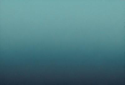 The primary subject of the image is a large body of water, which appears to be a vast ocean. The setting is a dark blue sky, creating a dramatic backdrop for the water. The visual style of the image is a photo, capturing the beauty of the ocean and the sky. The colors and mood of the image are predominantly dark and moody, with the blue hues of the water and sky creating a sense of depth and vastness.