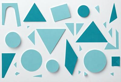 The primary subject of the image is a collection of geometric shapes, including triangles and circles, arranged on a white surface. The shapes are primarily blue and are displayed in various orientations. The setting is a white background, which provides a clean and minimalist appearance to the shapes. The visual style is a combination of digital art and illustration, as the shapes are well-defined and the arrangement is precise. The dominant colors are blue, and the overall atmosphere is calm and organized.