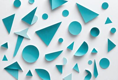 The primary subject of the image is a collection of blue triangles, which are arranged in various shapes and sizes. The setting is a white wall, and the visual style appears to be a combination of digital art and illustration. The dominant colors are blue and white, creating a clean and modern atmosphere.