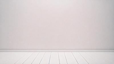 The primary subject of the image is a white wall with a white floor. The setting is a room with a white wall and floor, creating a clean and minimalistic atmosphere. The visual style is a photo, capturing the white wall and floor in detail. The colors and mood are predominantly white, giving the image a calm and serene feel.