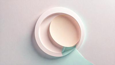 The primary subject of the image is a white and blue circle, which is the main object, scene, or focus of the image. The circle is placed on a white surface, which serves as the setting or background. The visual style of the image is a combination of photo and digital art, as it appears to be a photo of a digital art piece. The dominant colors in the image are white and blue, creating a calm and soothing atmosphere.
