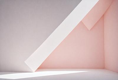 The primary subject of the image is a white triangle, which is the main object, scene, or focus of the image. The setting is a white wall, and the visual style is a photo. The dominant colors are white and pink, creating a clean and warm atmosphere.