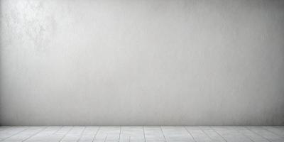 The primary subject of the image is a white wall. The setting is a room with a white floor. The visual style is a photo, and the colors and mood are predominantly white, giving the image a clean and minimalist appearance.